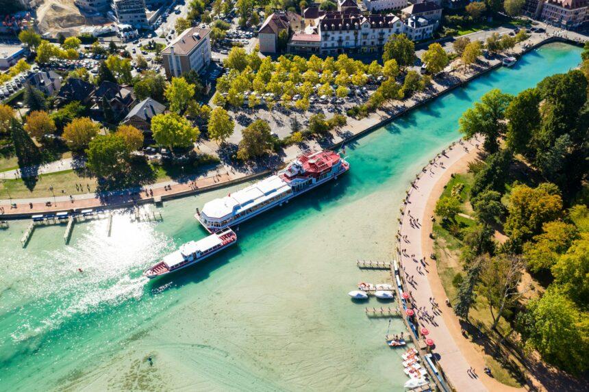 Aerial view of Annecy lake waterfront low tide level due to the