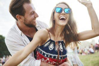 Couple laughing and enjoying music festival