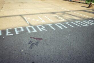 Deportation written on sidewalk