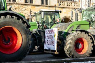 Farmers union protest strike against government Policy in Germany Europe. Tractors vehicles blocks