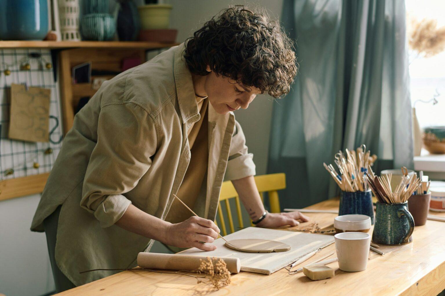 Female Artisan Cutting Clay