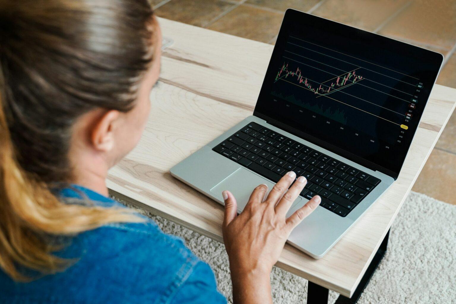 Trader business woman using crypto exchange for investment on stock market - Fintech