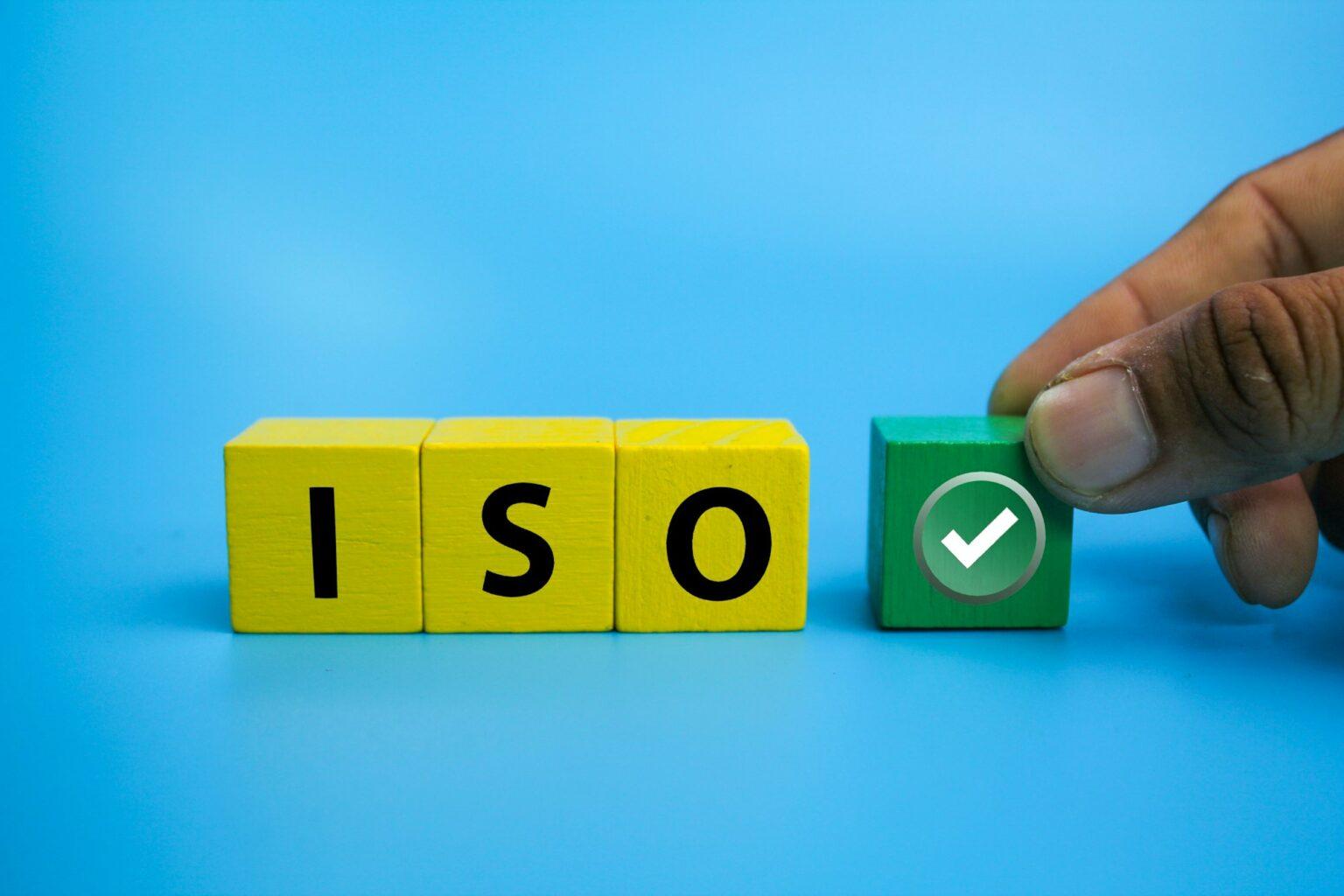 wooden cubes with the letter ISO and the right sign.