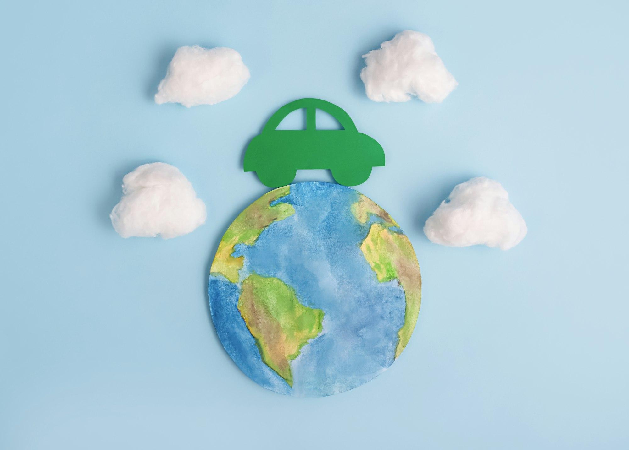 Green car and planet earth. Ecological transport. Ecology concept.