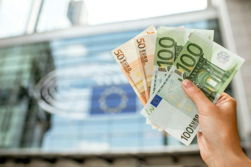 Holding euro banknotes