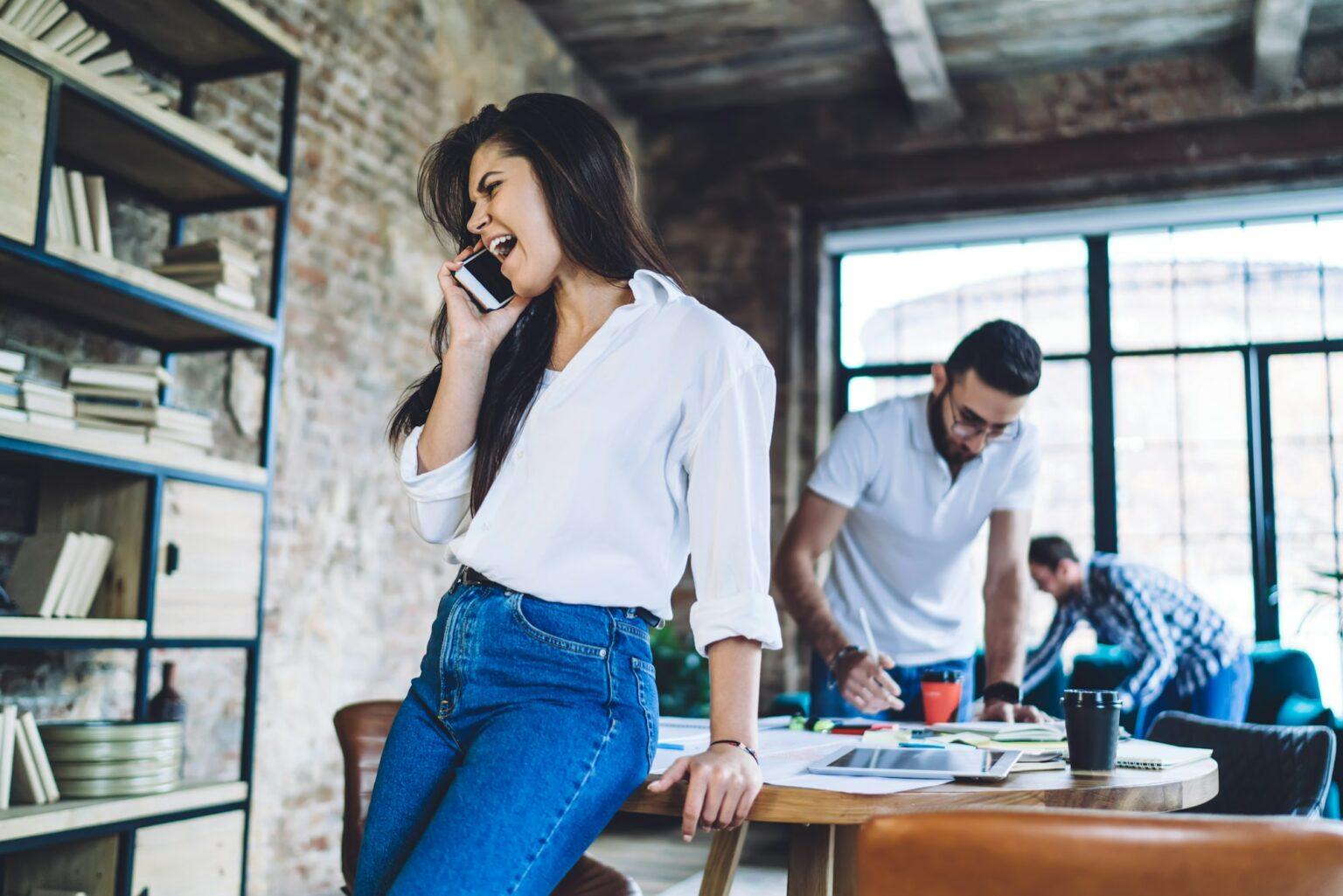 Irritated woman having unpleasant conversation