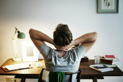 Man stressed while working on laptop