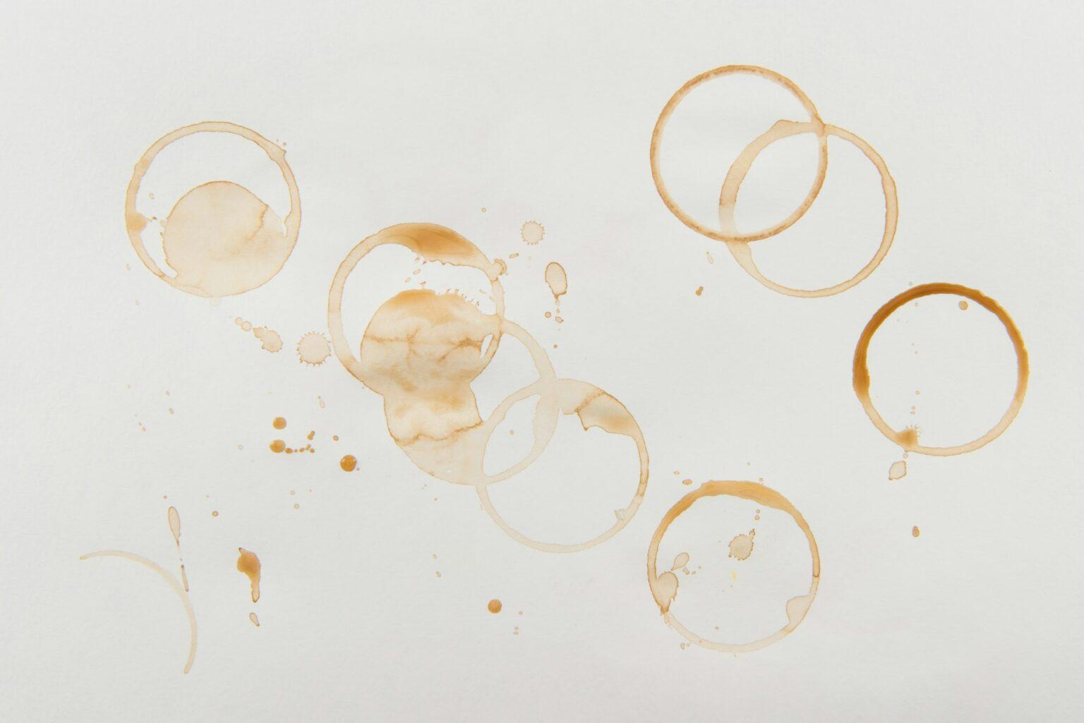 Top view of brown coffee stains on grey background