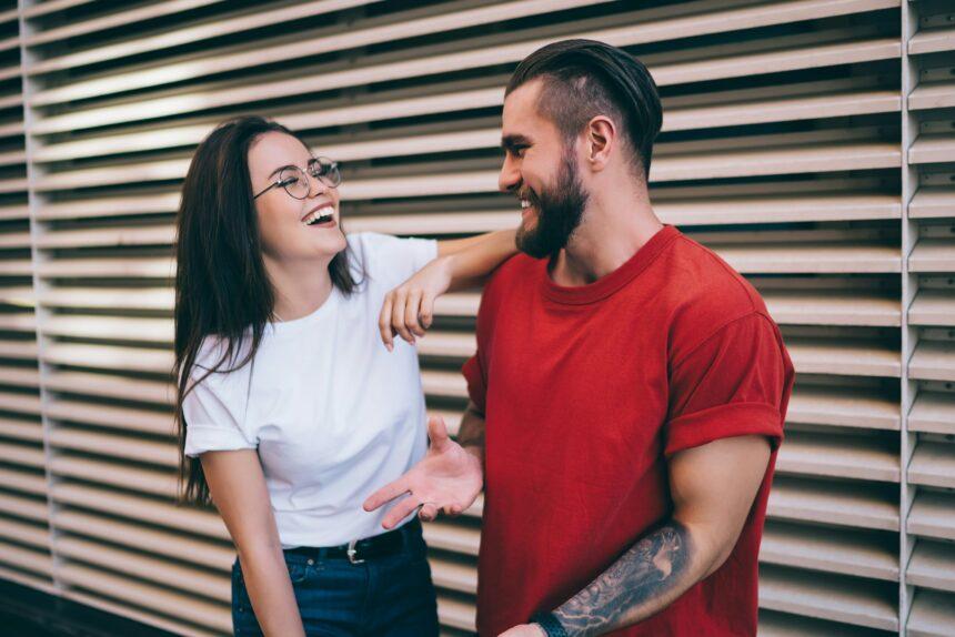 Young couple speaking on street