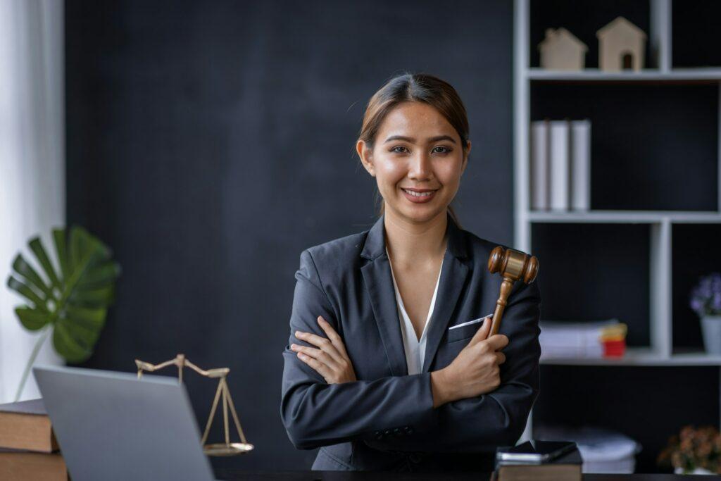 Attractive young lawyer in office Business woman and lawyers discussing contract papers with brass s