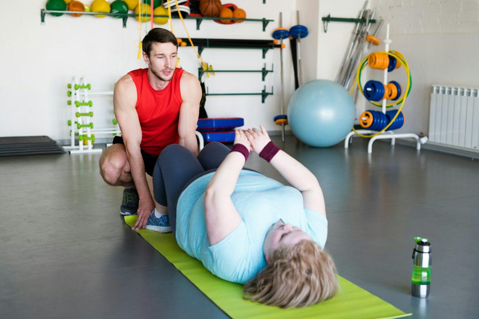 Obese Woman Doing Crunches in Health Club