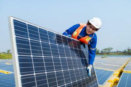 Technician Adjusting Solar Panel at Installation Site