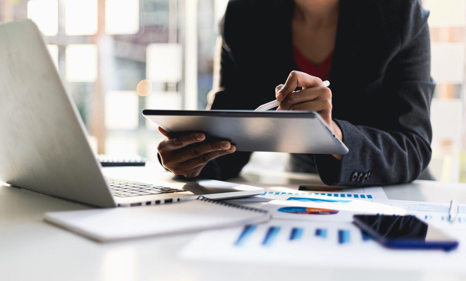 Businesswoman analyzing business strategy, planning finances and investing.