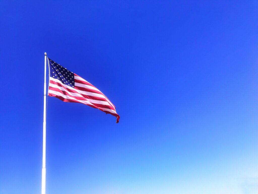 American flag minimal image in the sky flying