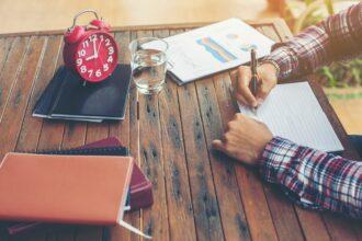 Hipster Businessman Working writing Determine Workspace Lifestyle Concept.