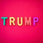 The word TRUMP isolated against red background shot from directly above