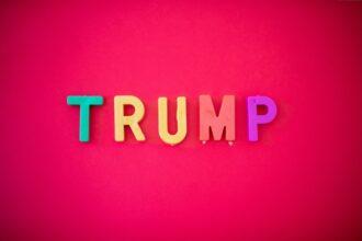 The word TRUMP isolated against red background shot from directly above