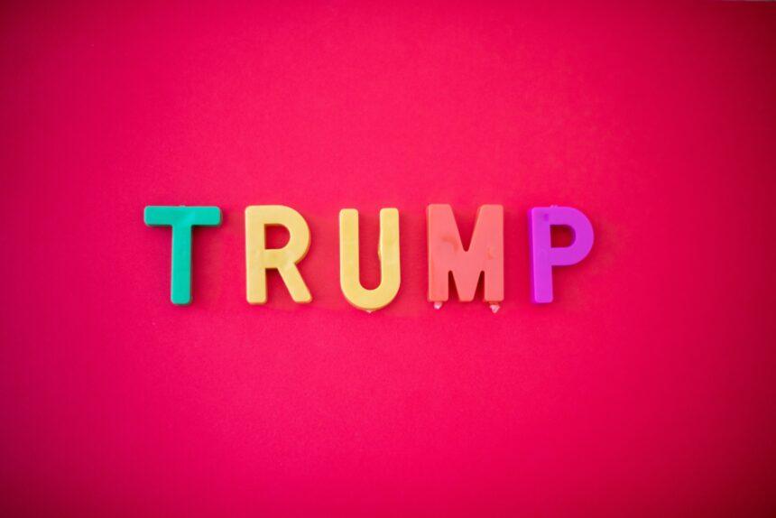 The word TRUMP isolated against red background shot from directly above