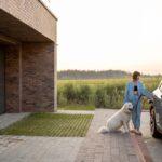 Woman charges electric car near her house