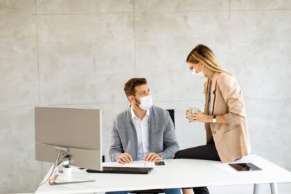 Business workers wear masks to protect and take care of their health in the office
