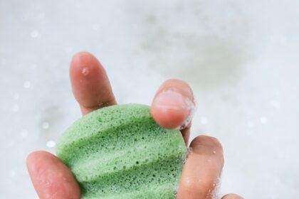 Konjac Sponge with Foam Bubbles in Female Hand, Close Up.