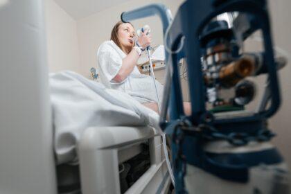 Pregnant Woman Using Gas and Air for Pain Relief in Hospital